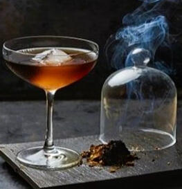 [ Oak Cask ] Dark whiskey and maple steeped in oak smoke, with notes of tea, incense, and bitter citrus oils. No trees were harmed in the cultivation of this drink, only coffins.